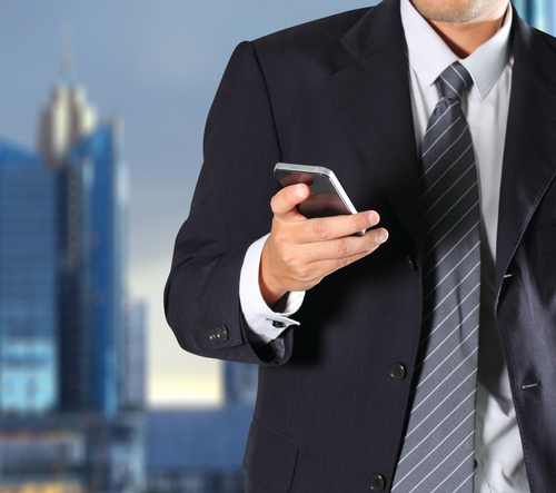 business man with phone shutterstock_108180836